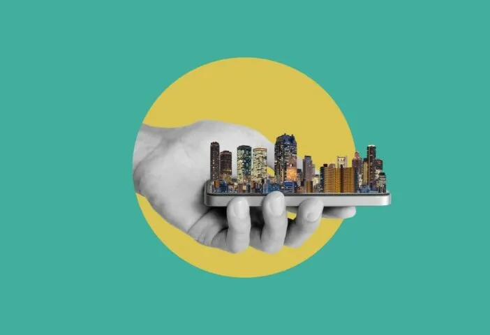 Illustration made out of picture of a hand holding a city model in representation of smart cities