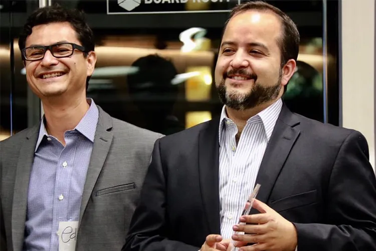 Two academic men laughing