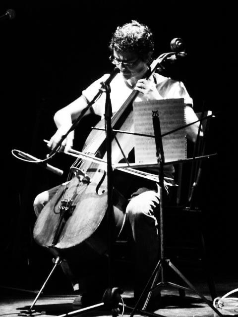 A young man playing a cello