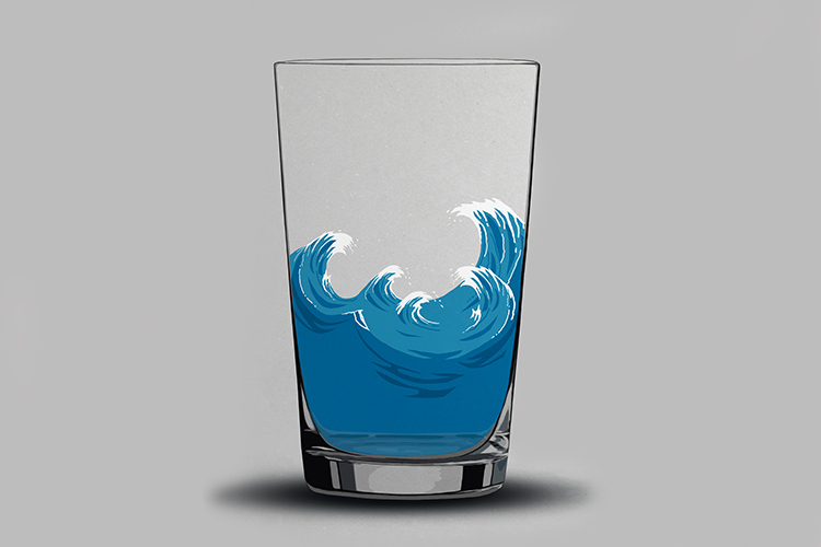 Glass of water with waves in it.
