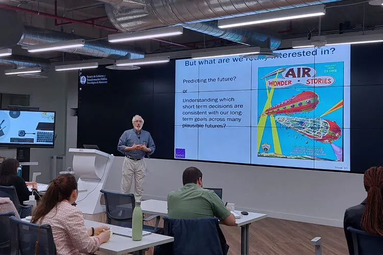 Man gives presentation in front of an audience