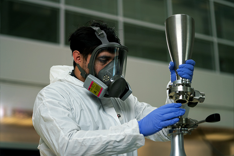 photo of a researcher next to an ultrasonic machine