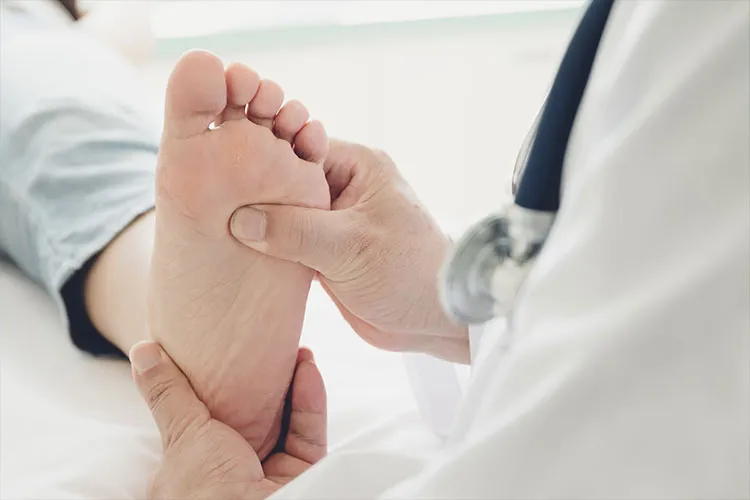 Physician checking a diabetic foot