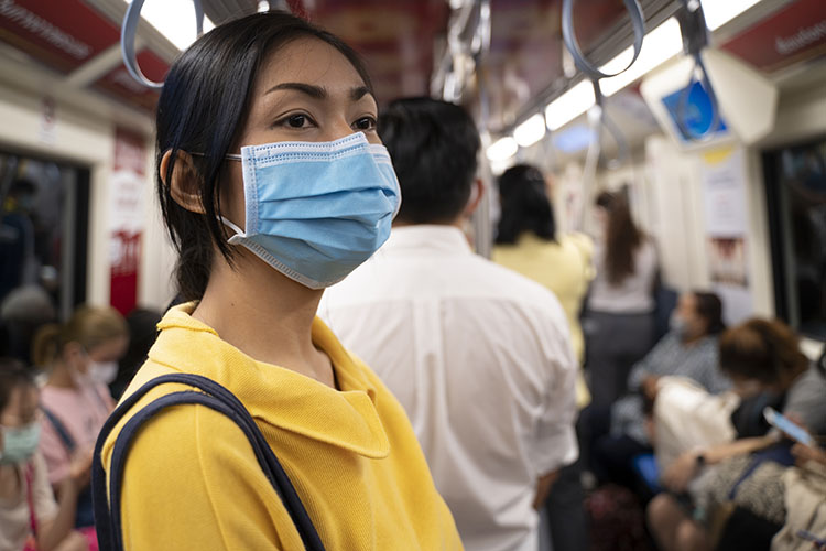 Masked girl to protect herself from Covid 19 virus in public area