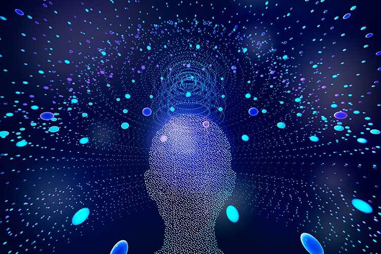 Image of a person's head made up of dots surrounded by blue dots on a blue background. The image is a digital illustration of a person's head. The head is made up of many small dots, which are arranged in a way that suggests the shape of a human head. The head is surrounded by a field of blue dots, which are also arranged in a circular pattern. The background of the image is a solid blue color.