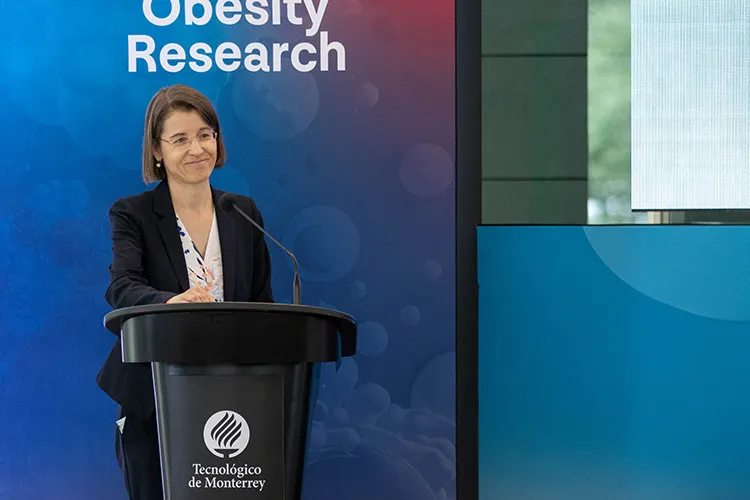 Photograph of a female researcher speaking in a panel