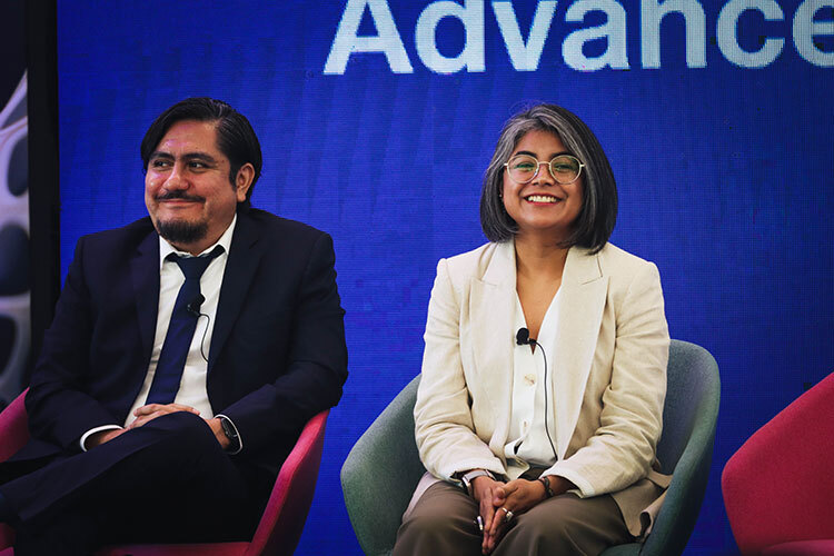 Photograph of a man and a woman sitting side by side