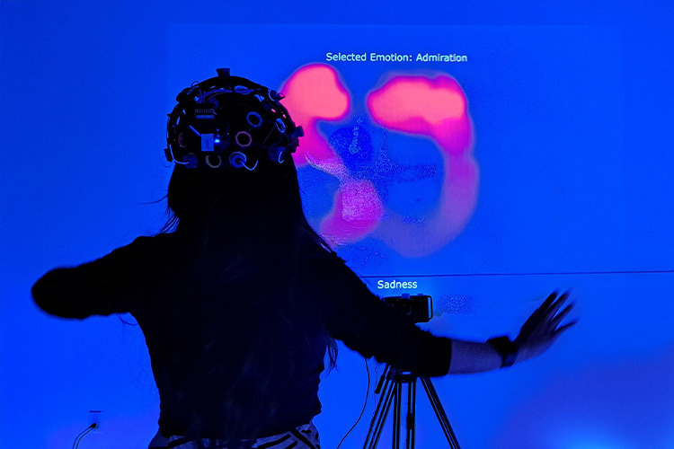 Photograph of a woman wearing a headband-shaped device