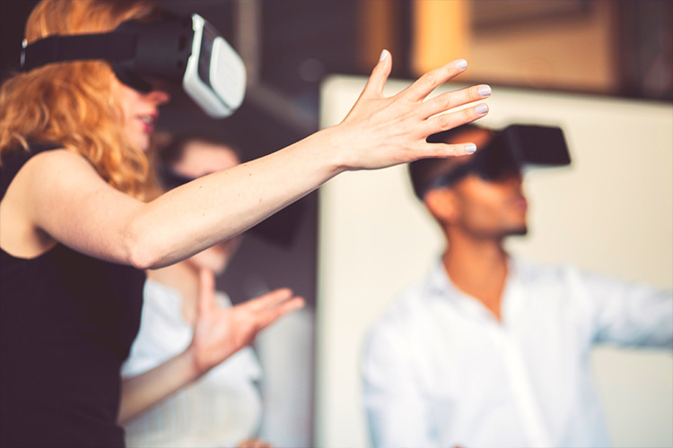 People playing with virtual reality headsets.