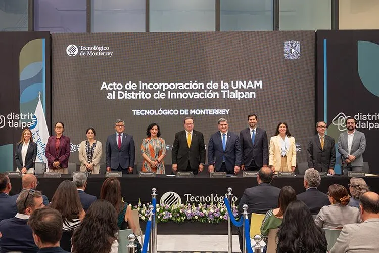 Photograph of a group of people standing at an academic ceremony