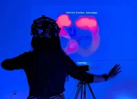 Photograph of a woman wearing a headband-shaped device