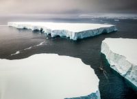 Sailing through enormously huge icebergs near Melchior islands in Antarctica