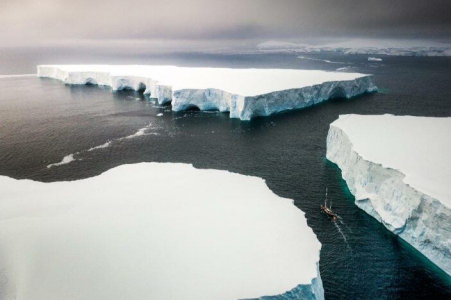 Sailing through enormously huge icebergs near Melchior islands in Antarctica