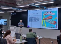 Man gives presentation in front of an audience