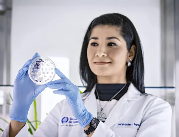 woman in lab checks exosomes on slides