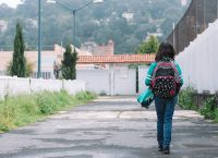 Photograph of a child walking on a street