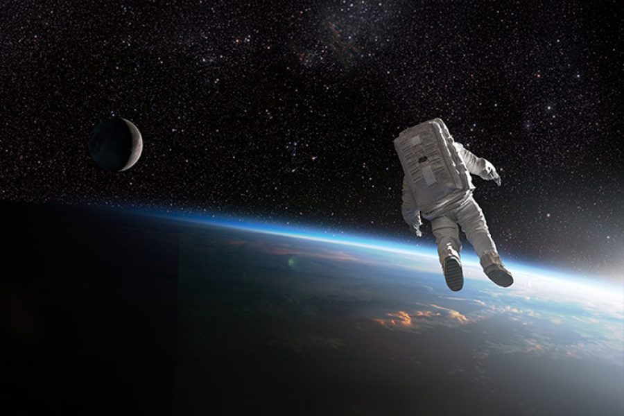 An astronauts observe the Earth from space.