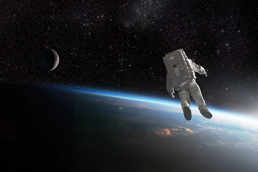 An astronauts observe the Earth from space.