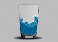 Glass of water with waves in it.