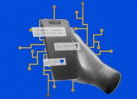 A cellphone is seen in an artificial hand, displaying a question mark and a heart.