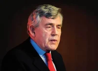 Elder man waring a blue dark suit