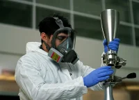 photo of a researcher next to an ultrasonic machine