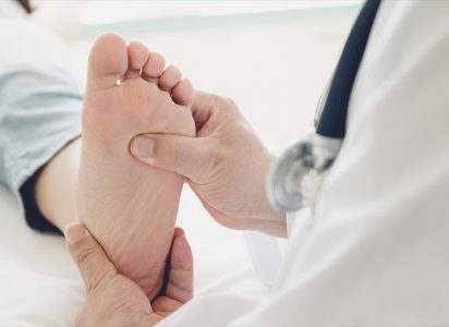 Physician checking a diabetic foot