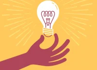 Mano agarrando un foco, representando una idea